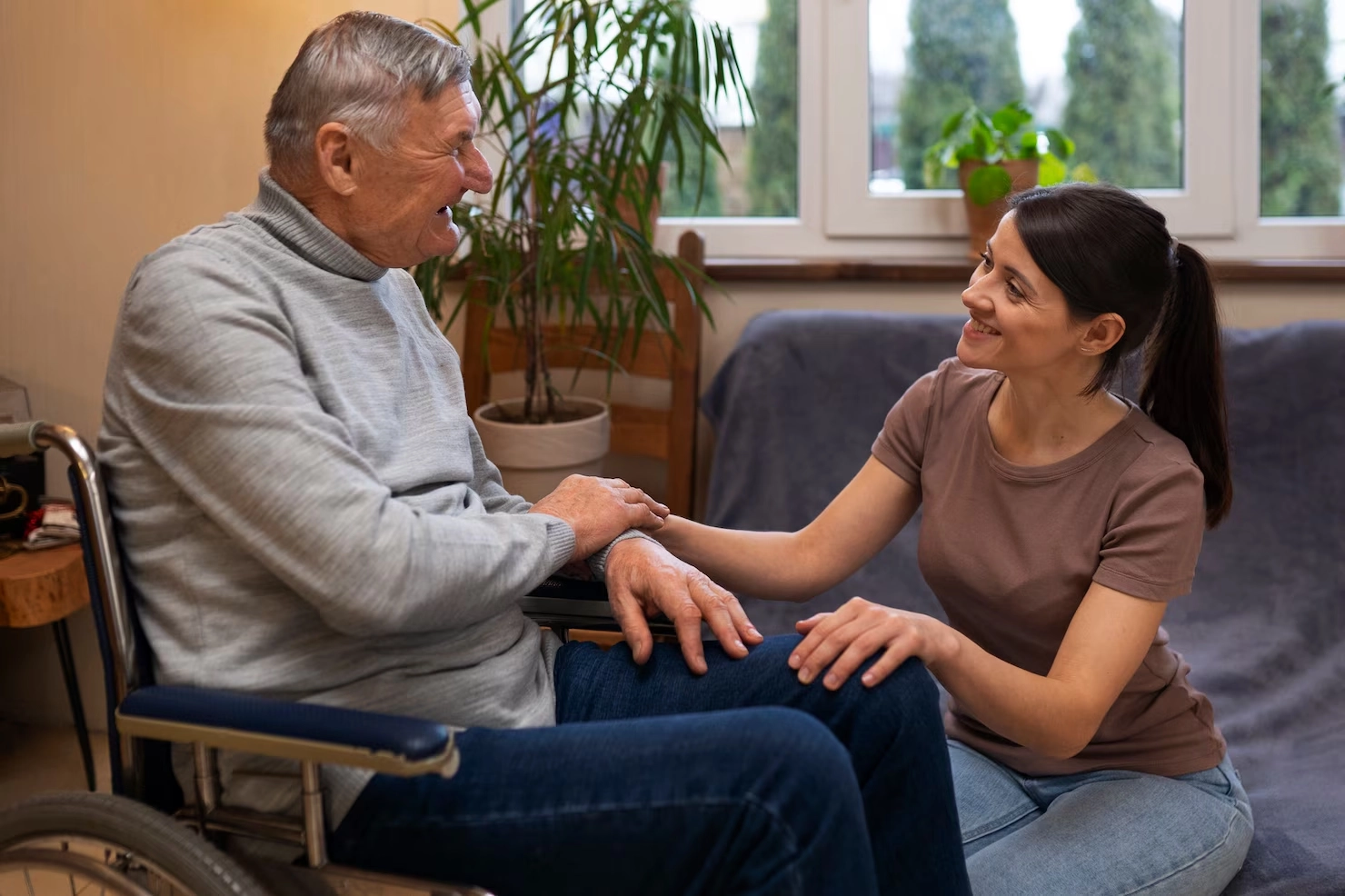 elderly-person-being-taken-care-by-female-caretaker